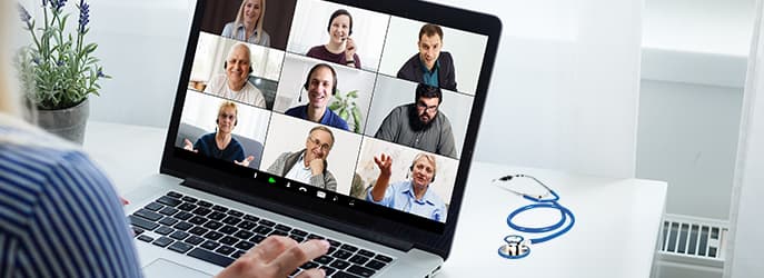 Person joining a video call webinar on a laptop