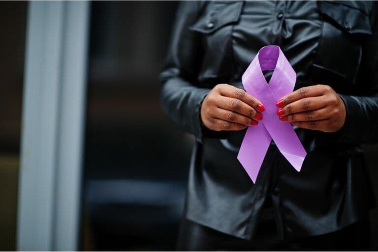 Woman experiencing joint pain, a common symptom of lupus