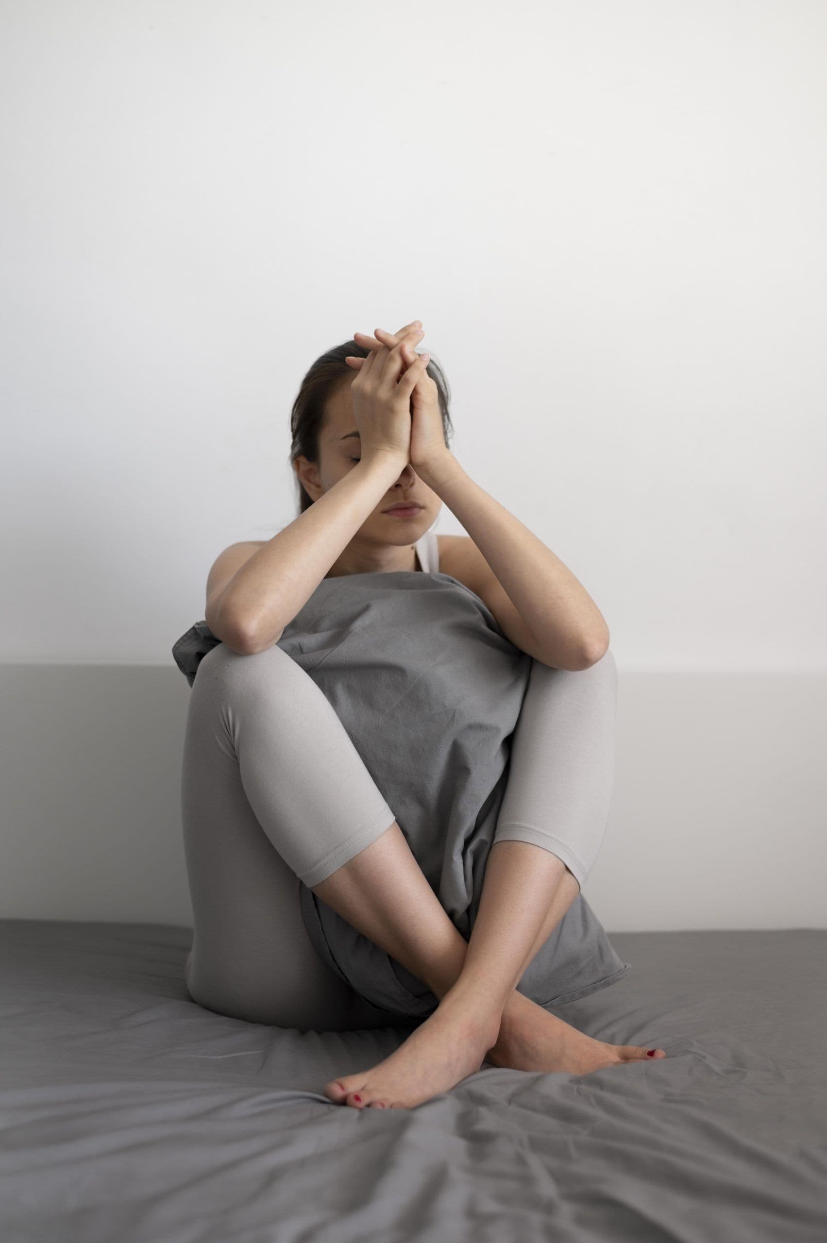Woman resting in bed due to fatigue from Sjögren's syndrome