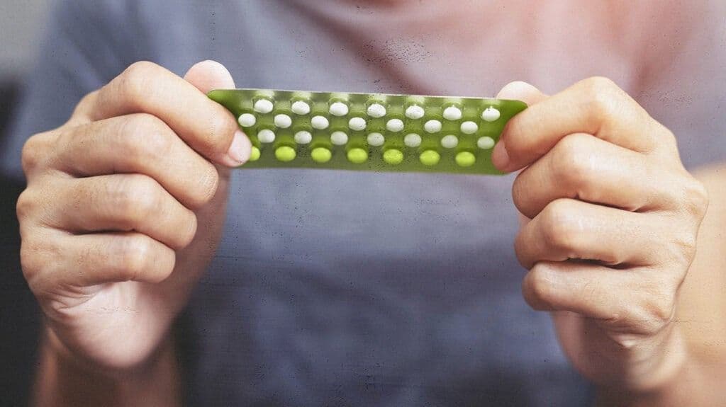 a woman holding medicines