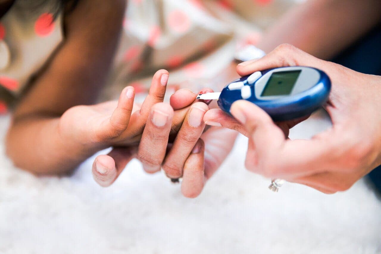 Person checking their blood glucose level