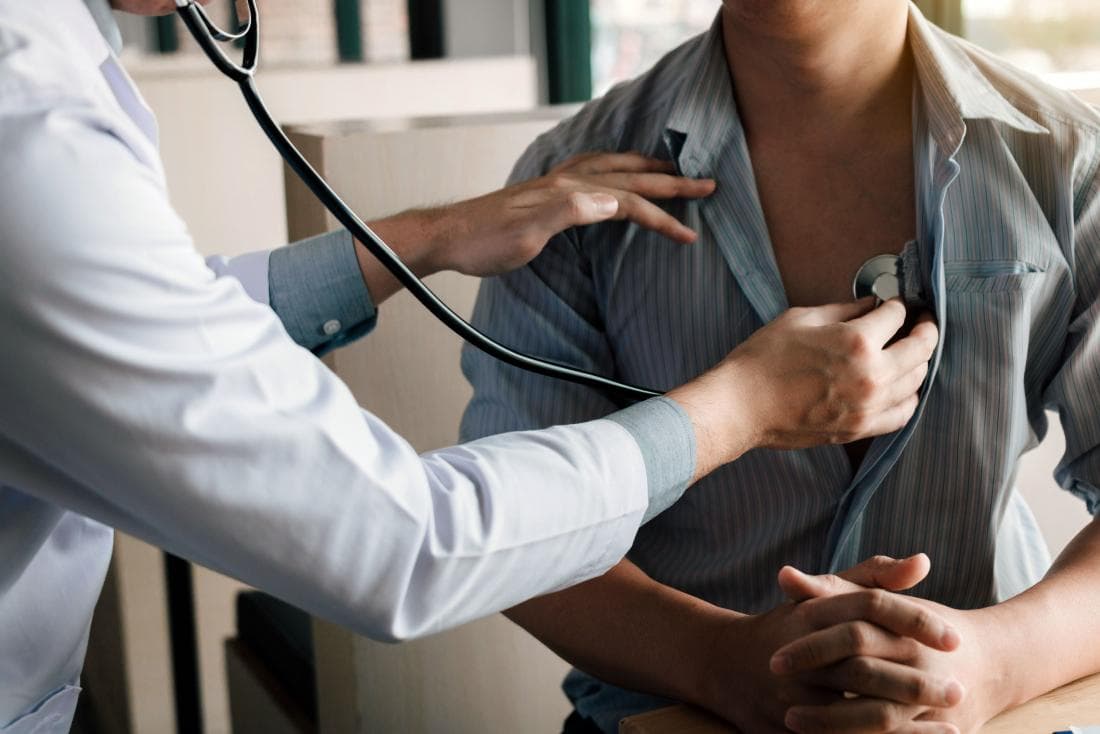 Doctor listening to a patient's heartbeat with a stethoscope