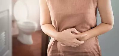 woman holding stomach